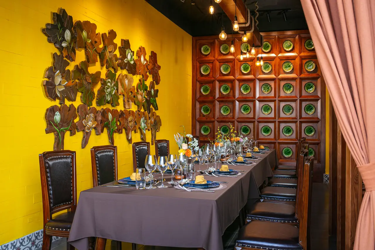 Dining room with a lotus-leaf wall piece and patterned plate panel